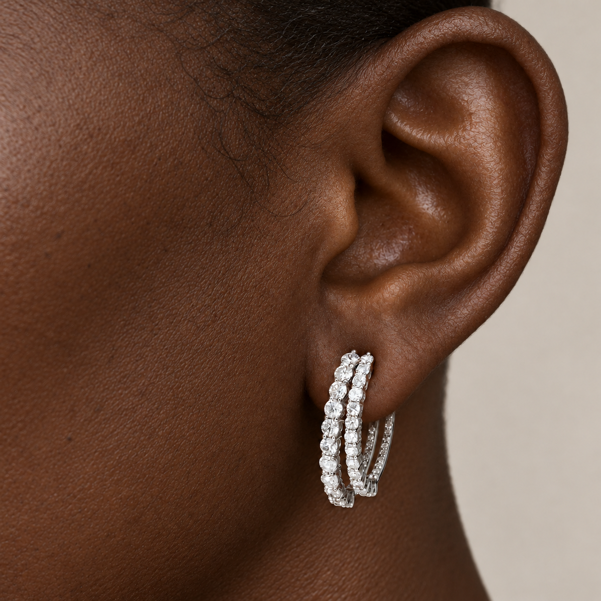 Double Curve Diamond Hoops by STUDIOHERSBY worn on the ear
