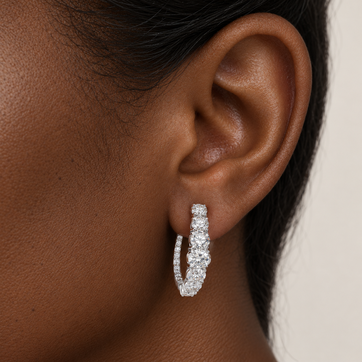Graduated Diamond Hoops by STUDIOHERSBY worn on the ear