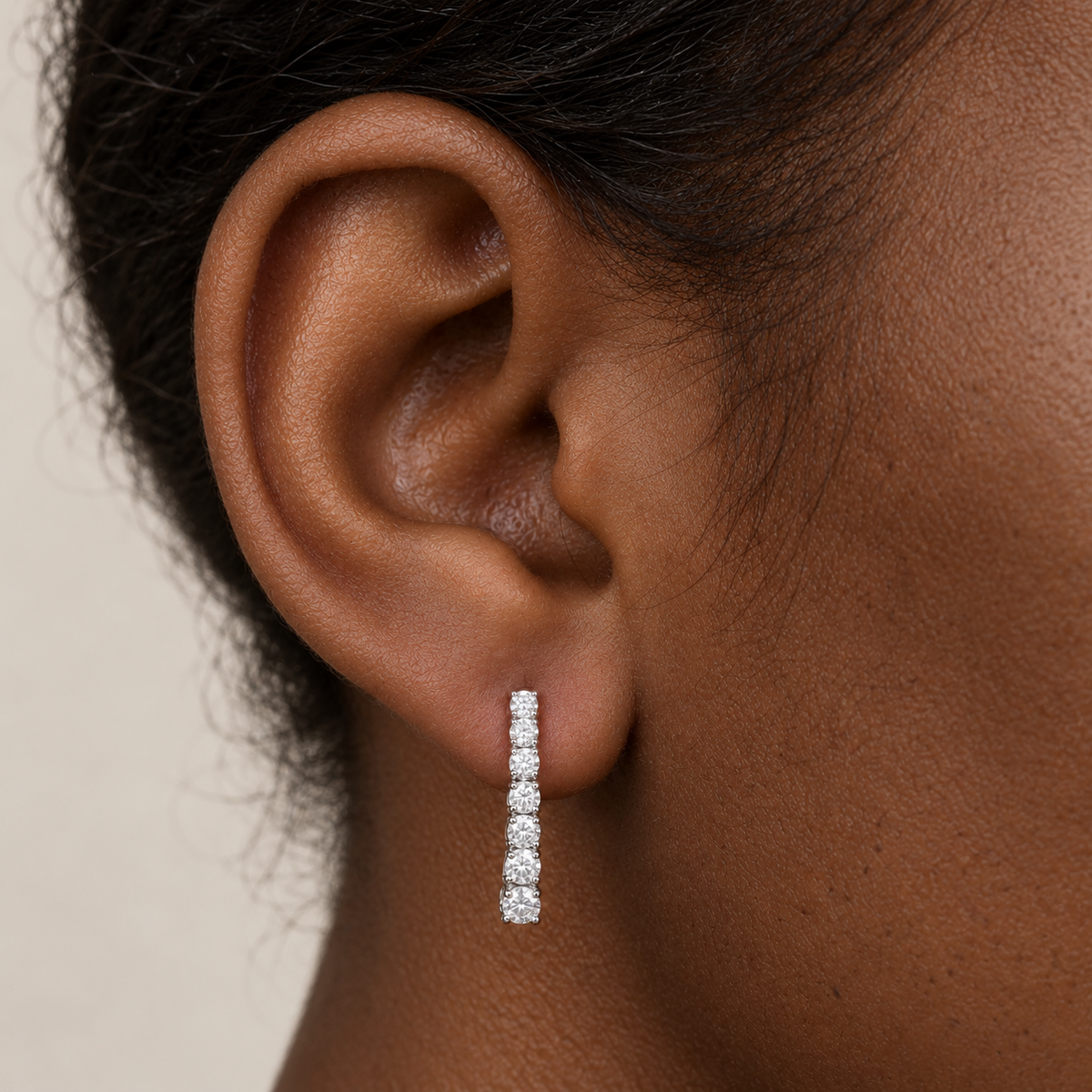 Petit Graduated Diamond Drops by STUDIOHERSBY worn on the ear